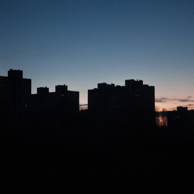 Building silhouettes without lighting, with evening sky and residual light from the setting sun.